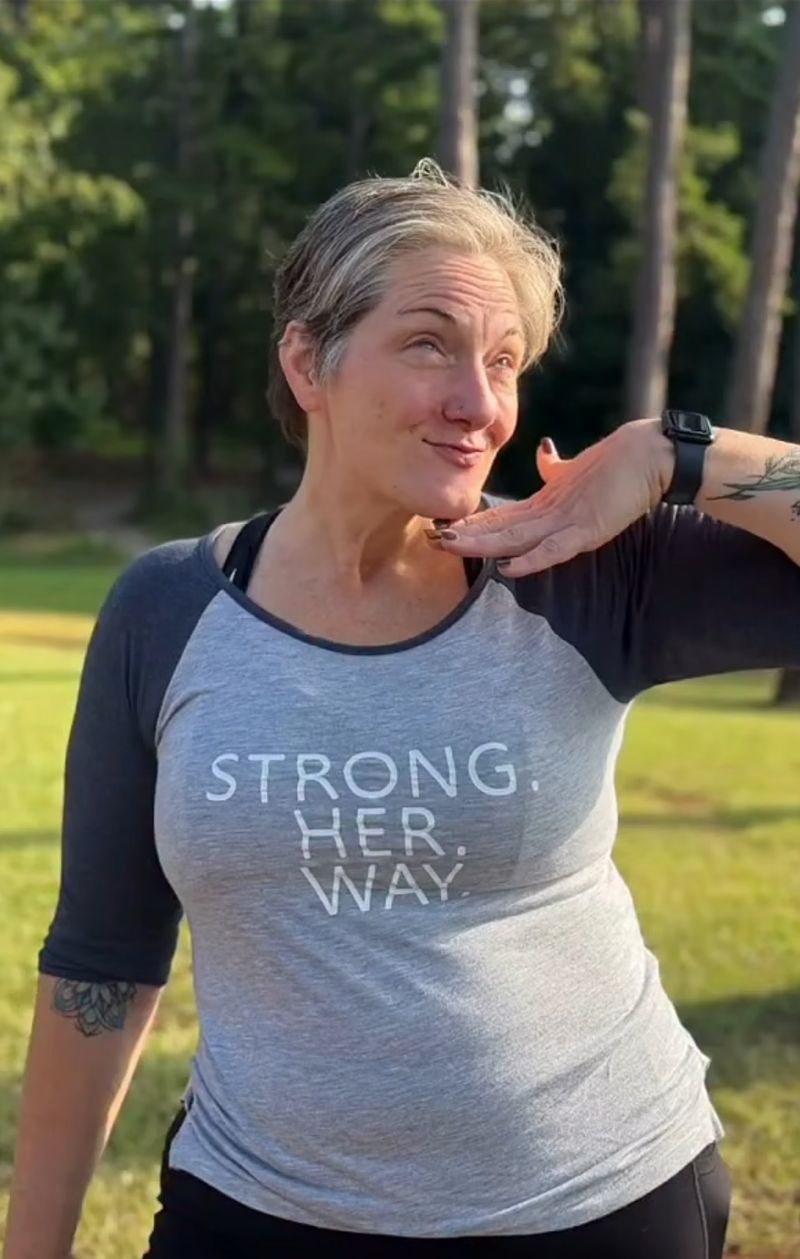 Member in a grey Strong. Her. Way. raglan
